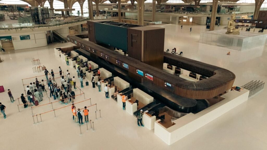 Techo International Airport terminal building interior, showcasing the natural light, lush greenery, and modern design.